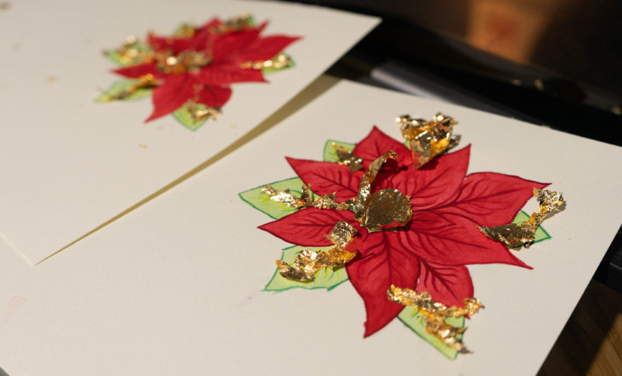 Gold leaf sections drying on Christmas card design
